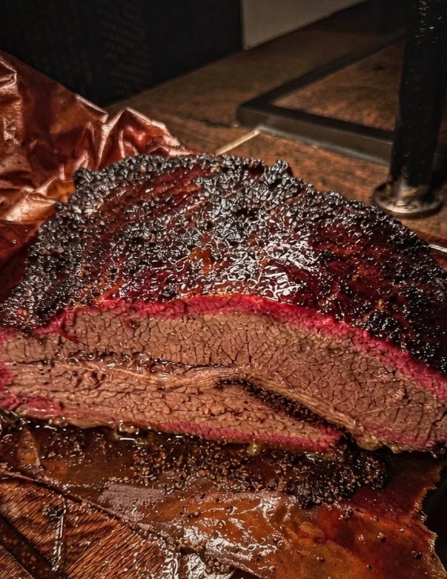 Sliced Henry’s brisket with a dark bark and deep pink smoke ring
